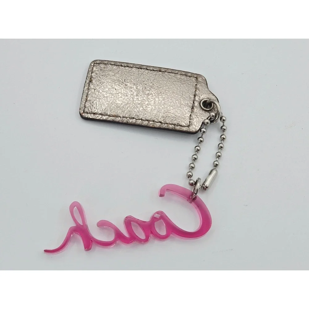 Coach POPPY Metallic Silver Leather Hangtag Pink Acrylic Script Logo Bag Charm